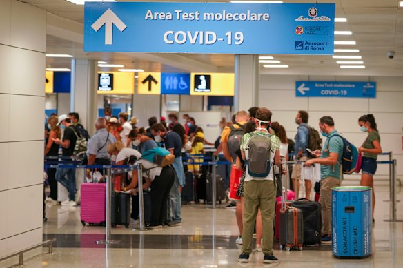 Travellers arrive at Rome's Leonardo da Vinci airport to be tested for the coronavirus as per a new rule imposed last week.