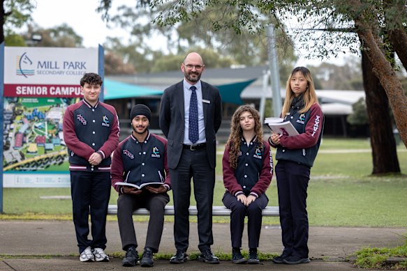 Mill Park Secondary College principal Tim Natoli and Mustafa Khraim, Shub Bath, Scarlett Yaziji and Yangu Pan.
