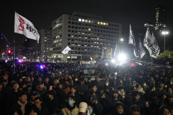 Protesters gathered outside the National Assembly building in Seoul after the martial law declaration.