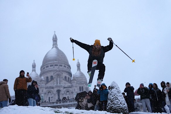 A man skies down the hill by the Sacré-Cœur Basilica in Montmartre, Paris on Monday.
