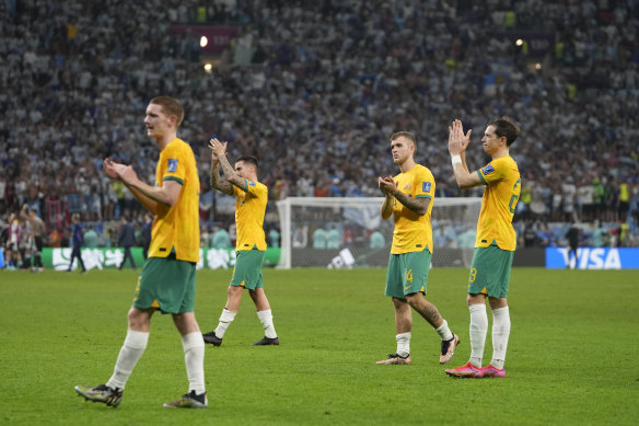 The Socceroos applaud the Australian supporters after their close loss to Argentina.