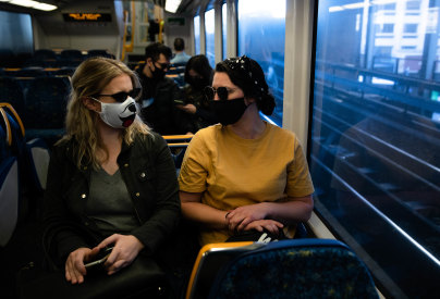 Passengers wear masks on a train between Central and Wynyard.