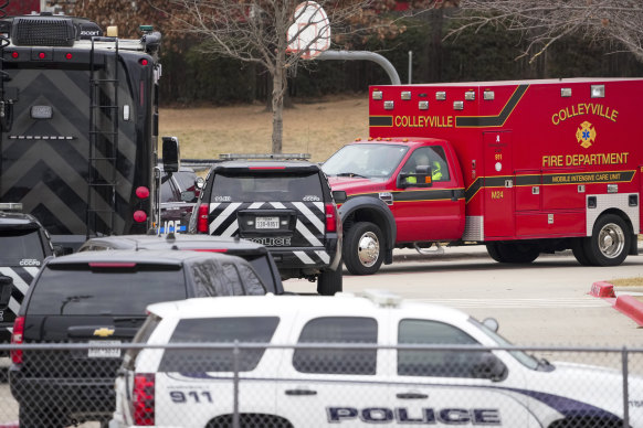 Emergency teams stage near Congregation Beth Israel in Colleyville, Texas, on Sunday AEDT.