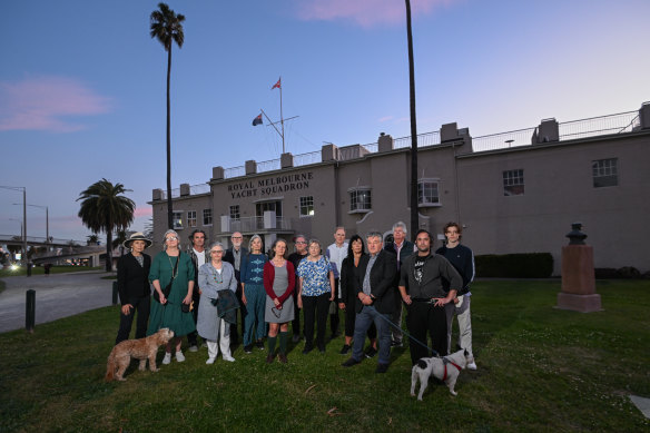 Serge Thomann (front with dog) and other St Kilda locals oppose the “extreme” redevelopment of the yacht club. 