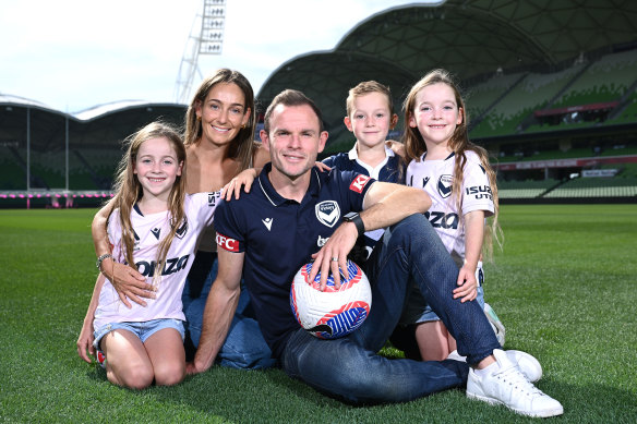 Leigh Broxham surrounded by his wife Sam and kids Billie, Sonny and Mila during his retirement announcement at AAMI Park.