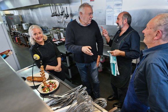 Restaurateur Barry Iddles (second left) has employed 12 older workers, aged between 60 and 74.