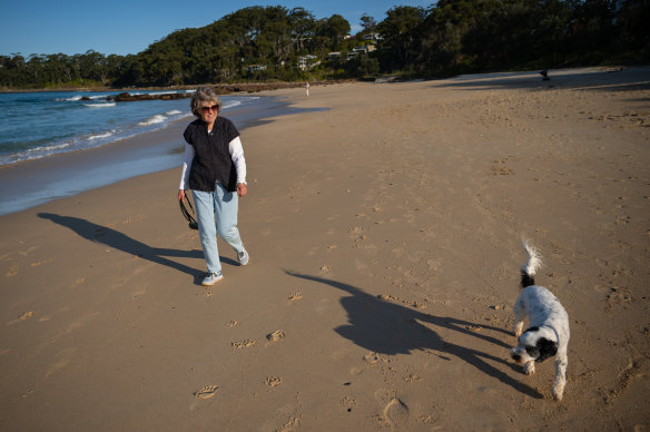 Lisa Martin, of Mollymook, walks Frank on Narrawallee Beach.