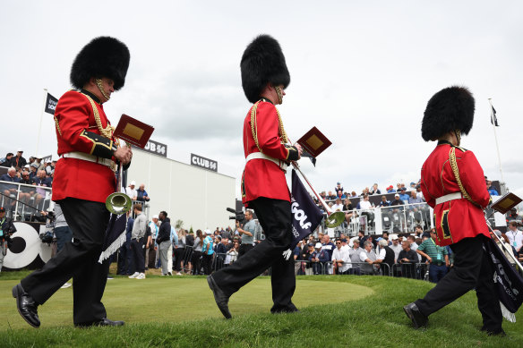 A brass band dressed as Grenadier Guards on the first tee at St Albans.