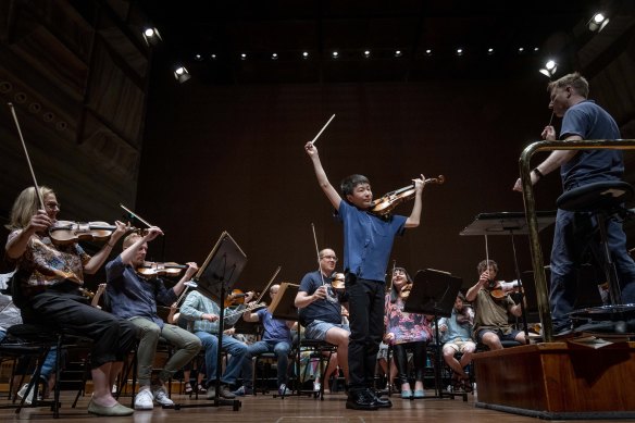Christian Li, the 14 year old prodigy violin player, rehearsing with the MSO at Hamer Hall.
