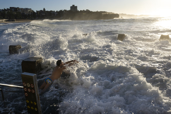 A swimmer braves the rough seas at Coogee on Monday.