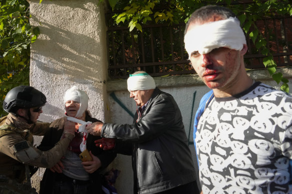 What about Russia’s war on Ukraine? People receive medical treatment at the scene of Russian shelling, in Kyiv, Ukraine.
