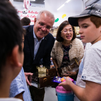 Prime Minister Scott Morrison visits Wallies Lollies in Box Hill South with MP Gladys Liu on Saturday.