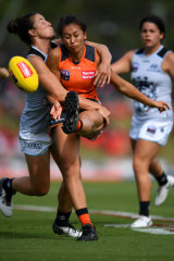 Best: Rebecca Beeson gets a kick away under pressure against Carlton in round three.