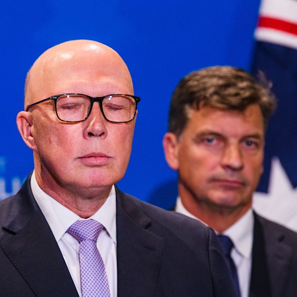 Peter Dutton with Angus Taylor coming up behind him