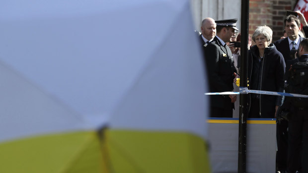 Minister Theresa May is briefed by police in Salisbury last week.