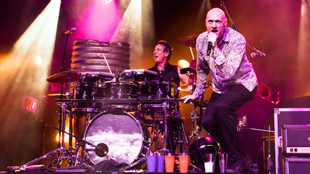 Midnight Oil plays at the Riverstage in Brisbane.