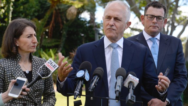 Prime Minister Malcolm Turnbull on Friday, flanked by premiers Gladys Berejiklian and Daniel Andrews.