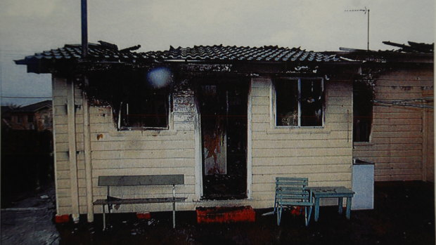 Photos from court documents show the house was reduced to ruins by the fire.