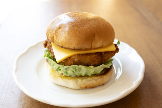 Fish burger made with hoki, cucumber pickles, mustard seed, lettuce and American cheddar.