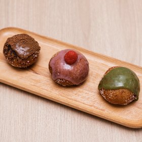 Mocha, raspberry and matcha sourdough doughnuts. 