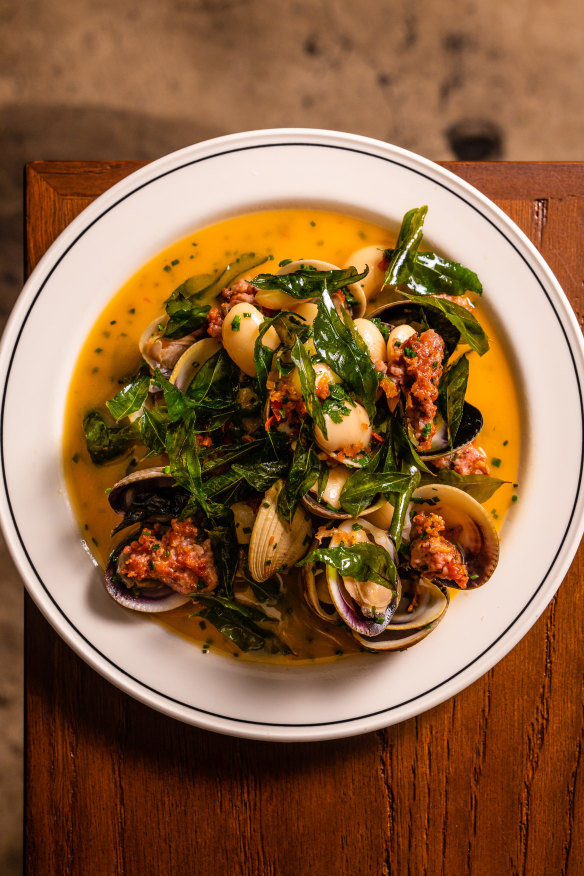 Vongole, butter beans, merguez and fried curry leaves. 