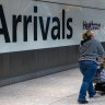 A passenger in the arrivals hall of Terminal 5 at London Heathrow Airport in London. The UK government wants to slash immigration levels.