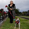 Carmen Terceiro visiting her father’s grave with her 8-year-old Jack Russell, Milo.