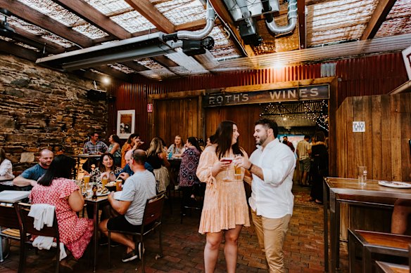 An outdoor dining area hosts live music and comedy acts. 