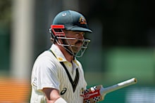 Australia’s Travis Head walks back to the pavilion after his dismissal on day five.