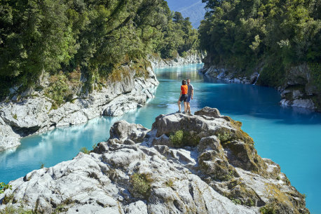 Hokitika Gorge is a sight to behold, with stunning blue waters surrounded by greenery.