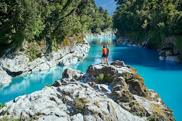 Hokitika Gorge is a sight to behold, with stunning blue waters surrounded by greenery.