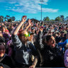 The crowd cheer for Baker Boy on stage.
