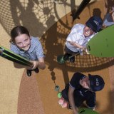 Students of Northern Beaches Christian School play on new playground equipment.