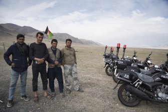 Afghan soldiers pose with newly-donated Chinese motorbikes at a remote checkpoint in the Wakhan Corridor.