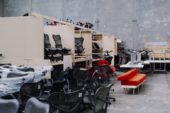 A warehouse filled with unwanted furniture from 500 Bourke Street.