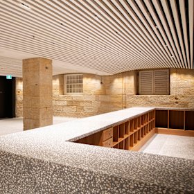 The glamorous new cloaking area on the ground floor features Australian terrazzo. 