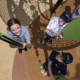 Students of Northern Beaches Christian School play on new playground equipment.