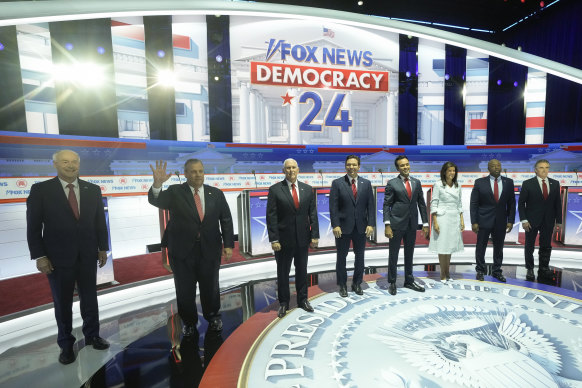 The other Republican presidential candidates (from left): former Arkansas governor Asa Hutchinson, former New Jersey governor Chris Christie, former vice president Mike Pence, Florida Governor Ron DeSantis, businessman Vivek Ramaswamy, former UN ambassador Nikki Haley, senator Tim Scott and North Dakota Governor Doug Burgum.