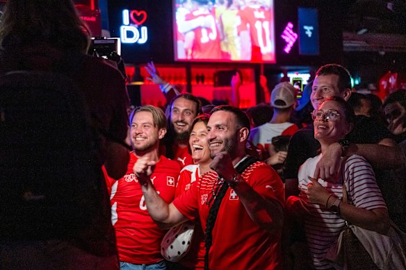 Swiss supporters watch on.