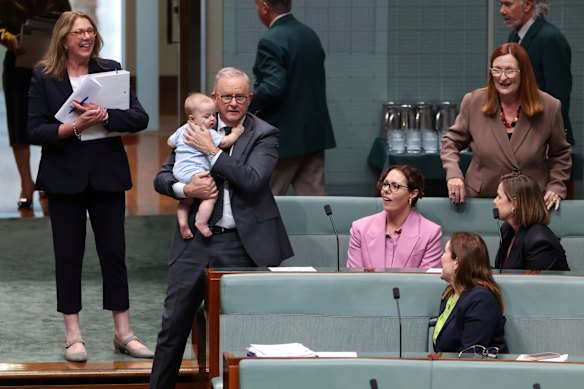 Holding the baby: Prime Minister Anthony Albanese in parliament on Thursday with young Joseph, the son of the member for Canberra, Alicia Payne.