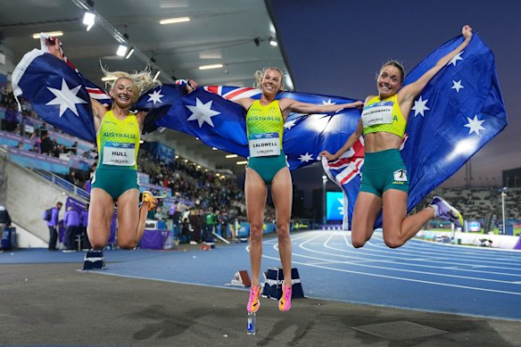 Gold medallist Abbey Caldwell, silver medallist Jessica Hull and bronze medallist Claudia Hollingsworth after the women’s one mile final at the Commonwealth Games.