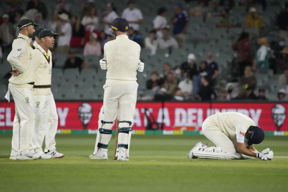 Joe Root doubles over in pain after being hit by a delivery from Mitchell Starc late on Sunday.