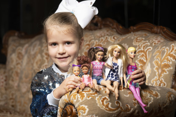 Maddison Gainge, 5, with her favourite Barbie dolls. At a high tea at the Casula Powerhouse, guests were invited to bring their favourite dolls. 