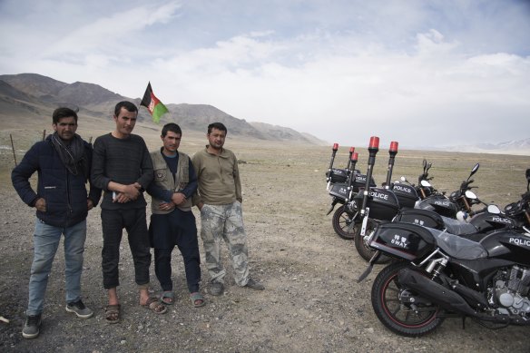 Afghan government soldiers pose with newly-donated Chinese motorbikes at a remote checkpoint in the Wakhan Corridor.