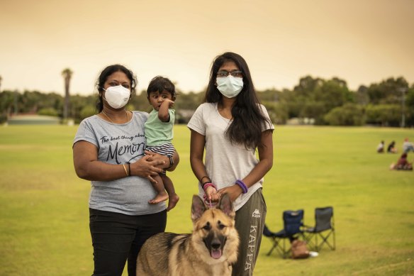 Radha, Parinnitha and Sarrvesh Rajini Kanth with pet dog Cookie at the Brown Park evacuation centre.