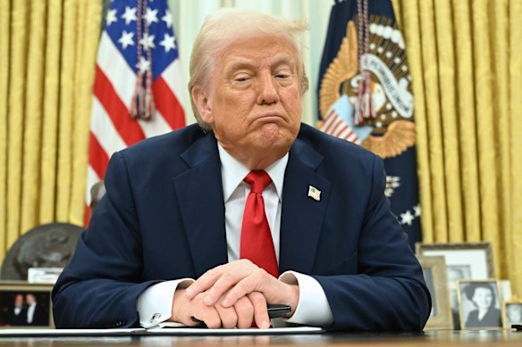 President Donald Trump speaks to reporters before signing an executive order in the Oval Office.
