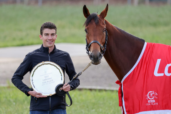 Joseph O’Brien’s travelling foreman Mark Power with State of Rest and the Cox Plate on Sunday.