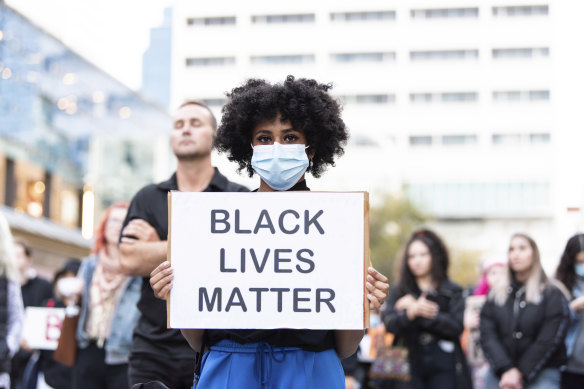 People wore facemasks and tried to adhere to social distancing measures as they protested in Forrest Chase. 