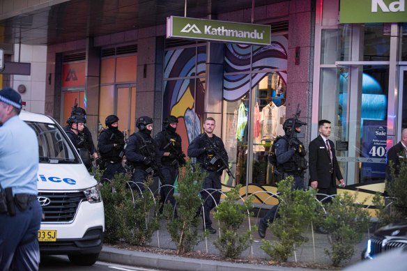 Police outside the shopping centre on Saturday. 