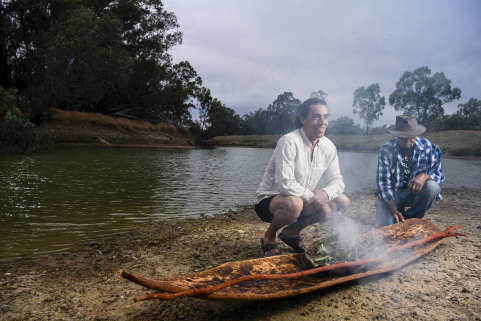 Art Gallery of NSW Indigenous educator Wesley Shaw with Barkandji artist Badger Bates at the launch of  Barkandji canoe. 